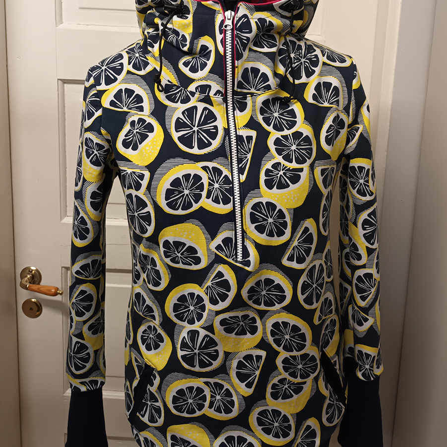 Black hoodie with lemon print on a mannequin.